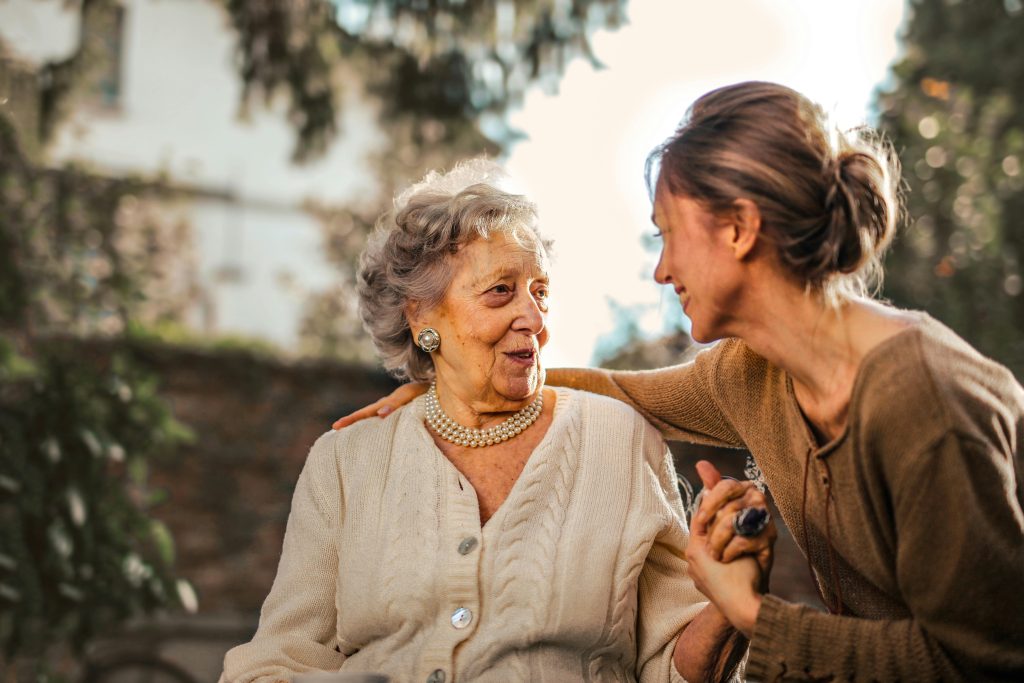 elderly talking to a woman